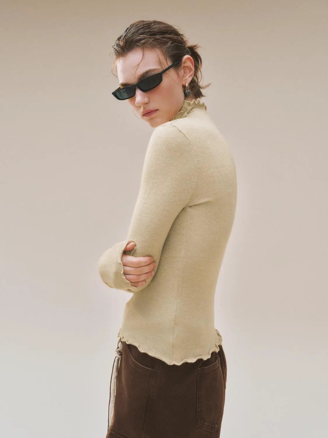 Ruffled Mock Neck Wavy Hem Long Sleeve Knit Top