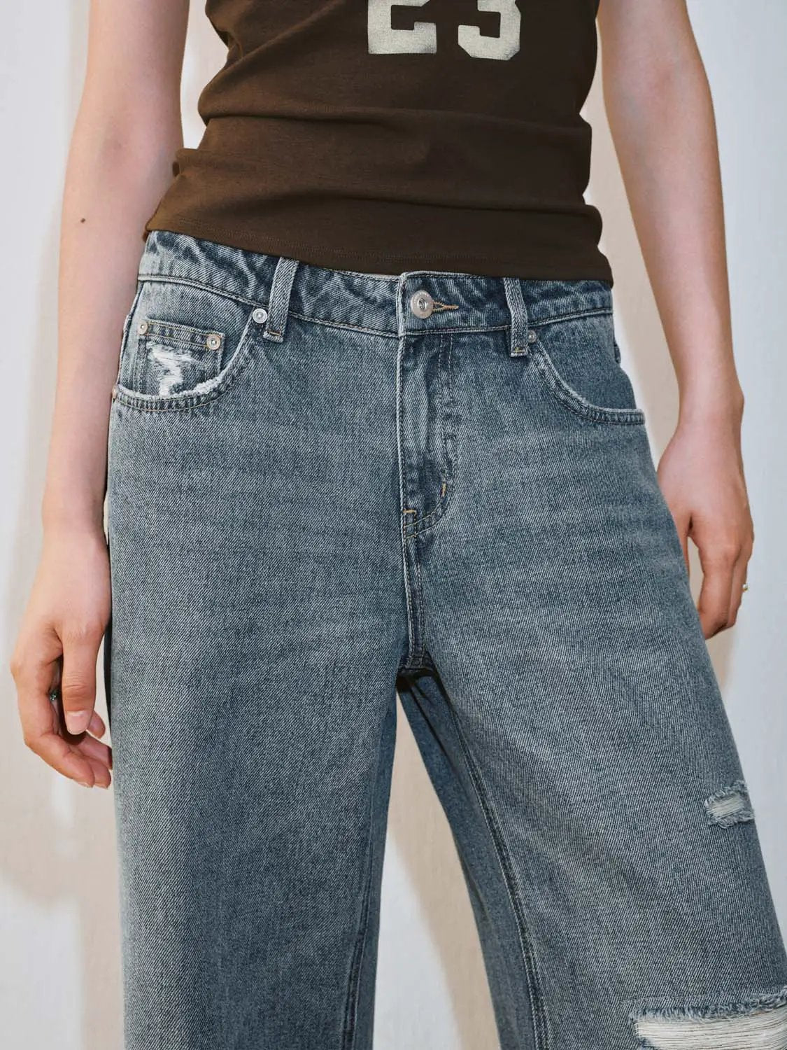 Mid Wash Distressed Raw Edge Relaxed Flare Leg Denim Jeans