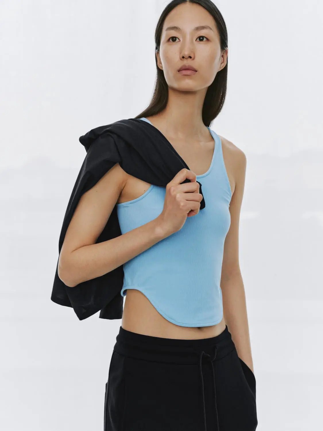Ribbed Fitted Sleeveless Curved Hem Tank Top