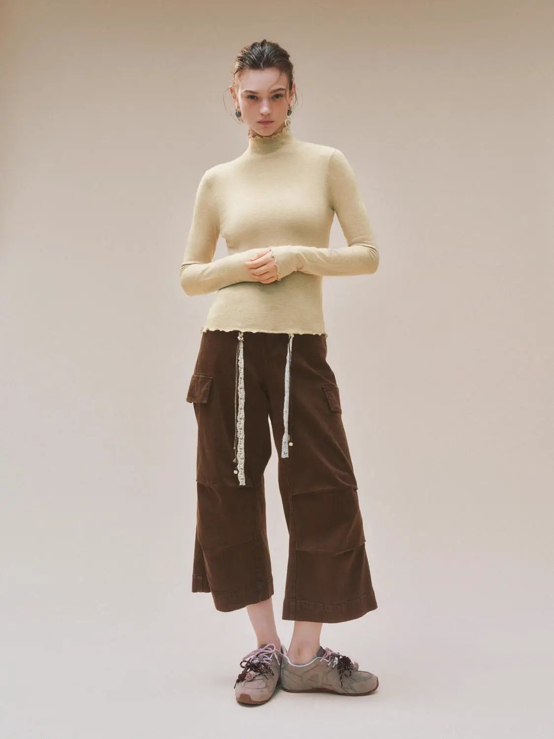 Ruffled Mock Neck Wavy Hem Long Sleeve Knit Top