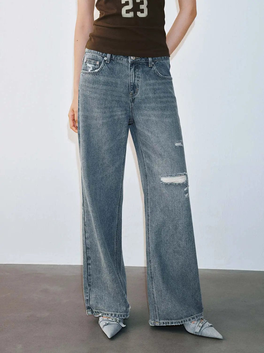 Mid Wash Distressed Raw Edge Relaxed Flare Leg Denim Jeans
